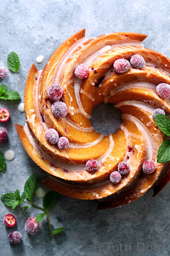 A beautiful cranberry orange Bundt with sugared cranberries